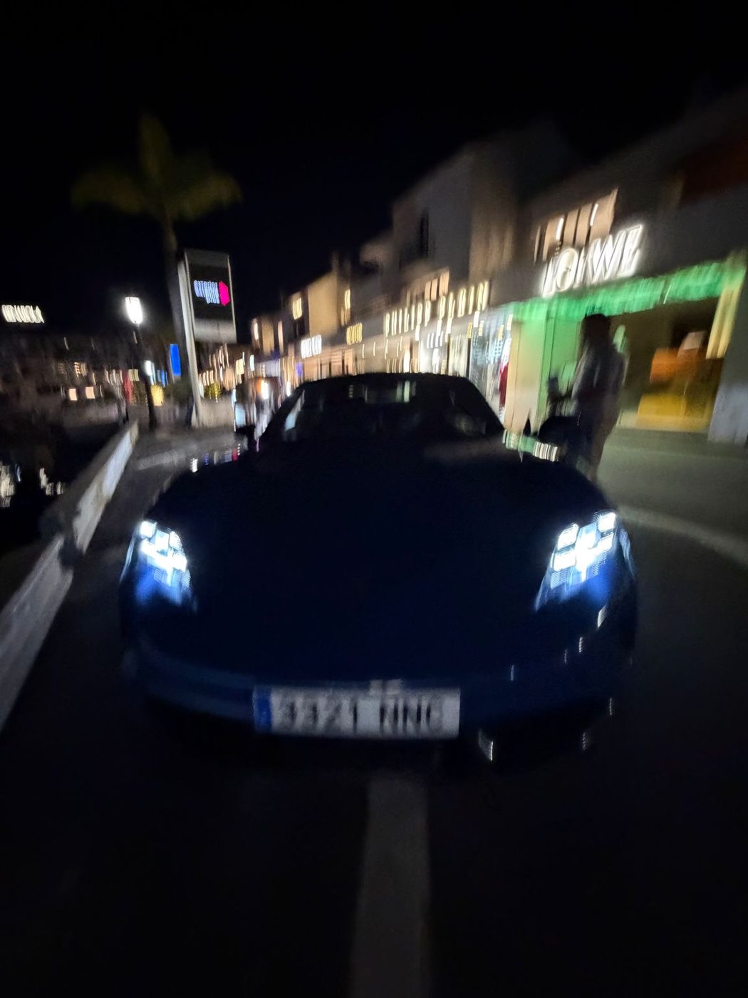 Blue Porsche at night
